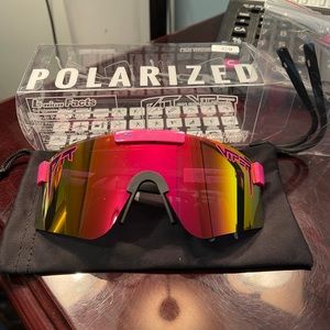 Women’s Pit Viper pink polarized snowboarding sunglasses.